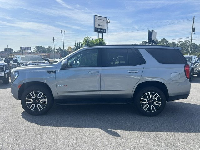 2024 GMC Yukon AT4 in Sterling Metallic — front three-quarter view