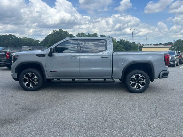 2025 GMC Sierra 1500 AT4 in Thunderstorm Gray — front three-quarter view